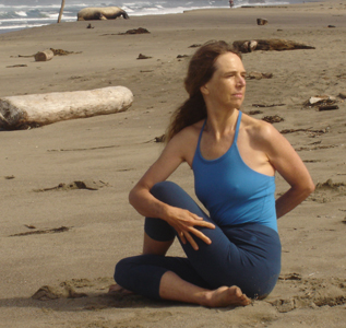 Student practicing yoga on beach in Sonoma County