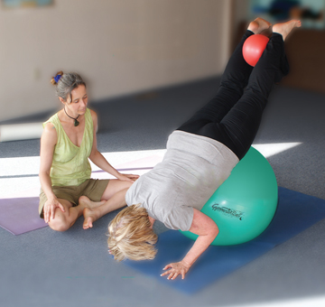 Sophie Phelps working with student in Mat Pilates in Bodega Bay, California