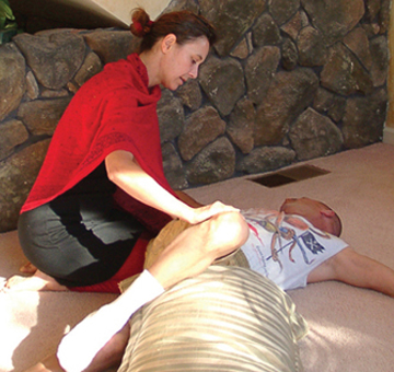 Sophie Phelps hands-on yoga  work with student in Santa Rosa, California